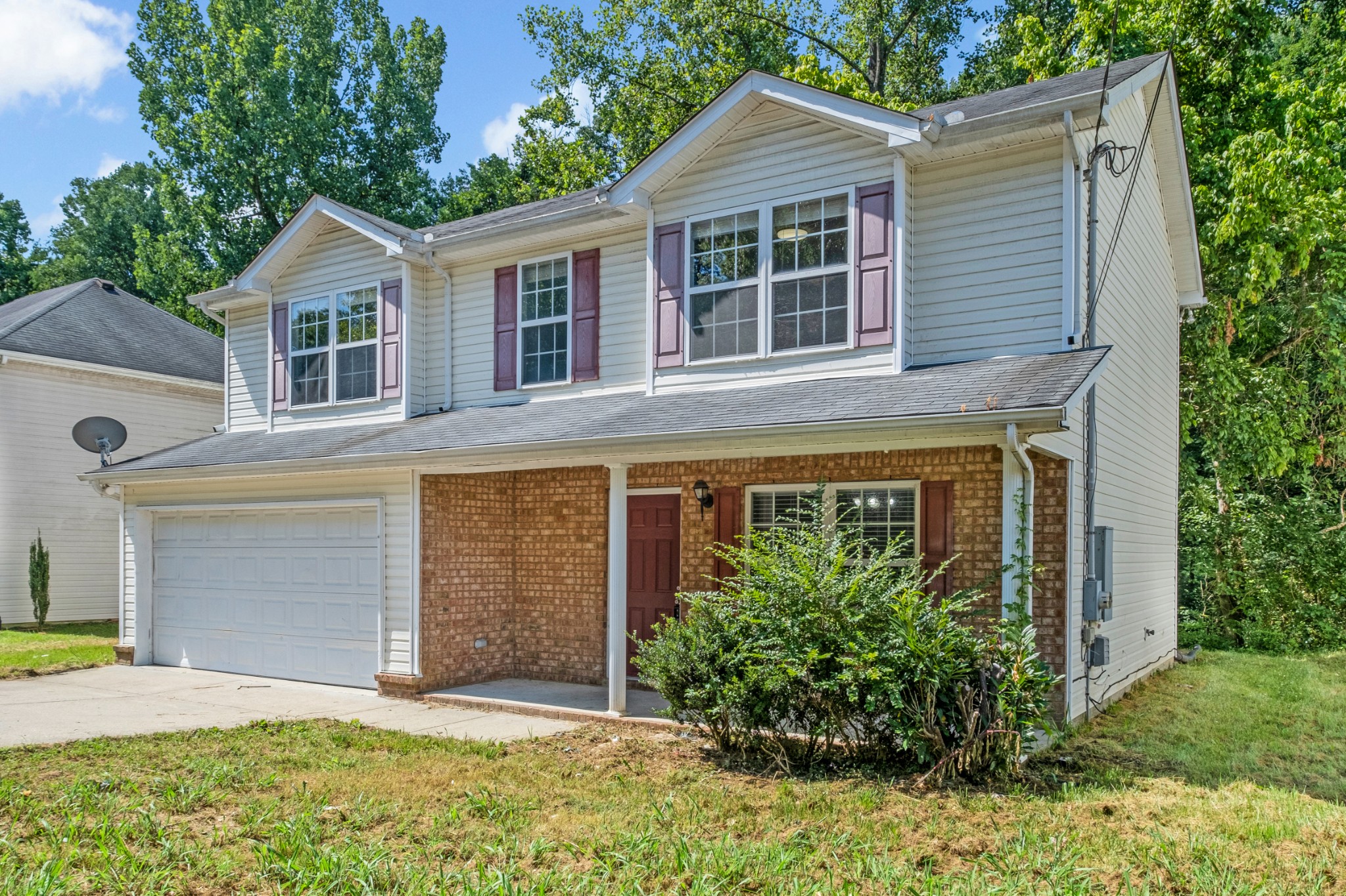 809 Dover Glen Drive Antioch, TN 37013 - Photo 2 of 23 a front view of a house with a yard and garage