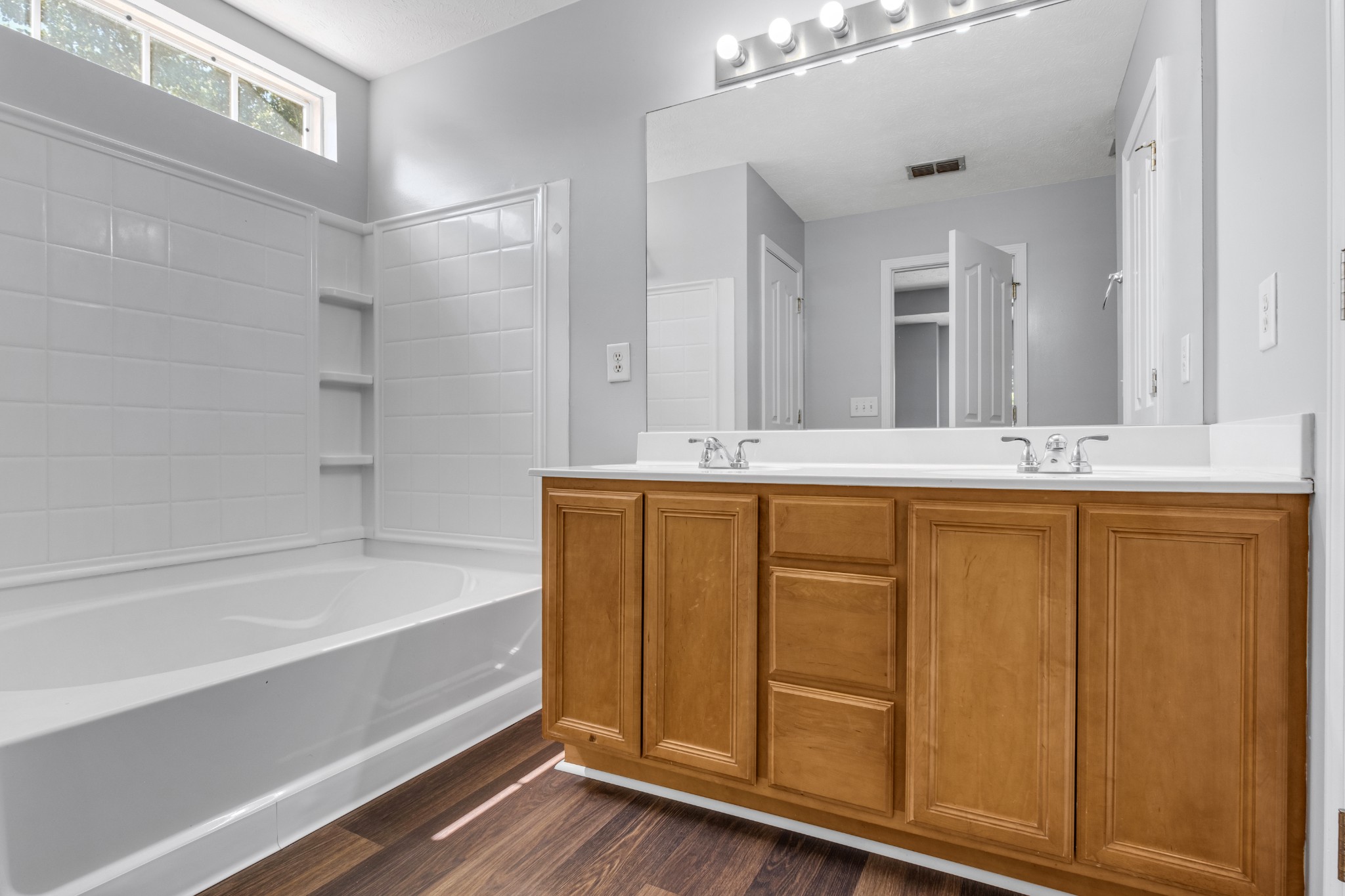 809 Dover Glen Drive Antioch, TN 37013 - Photo 22 of 23 a bathroom with a tub sink and mirror