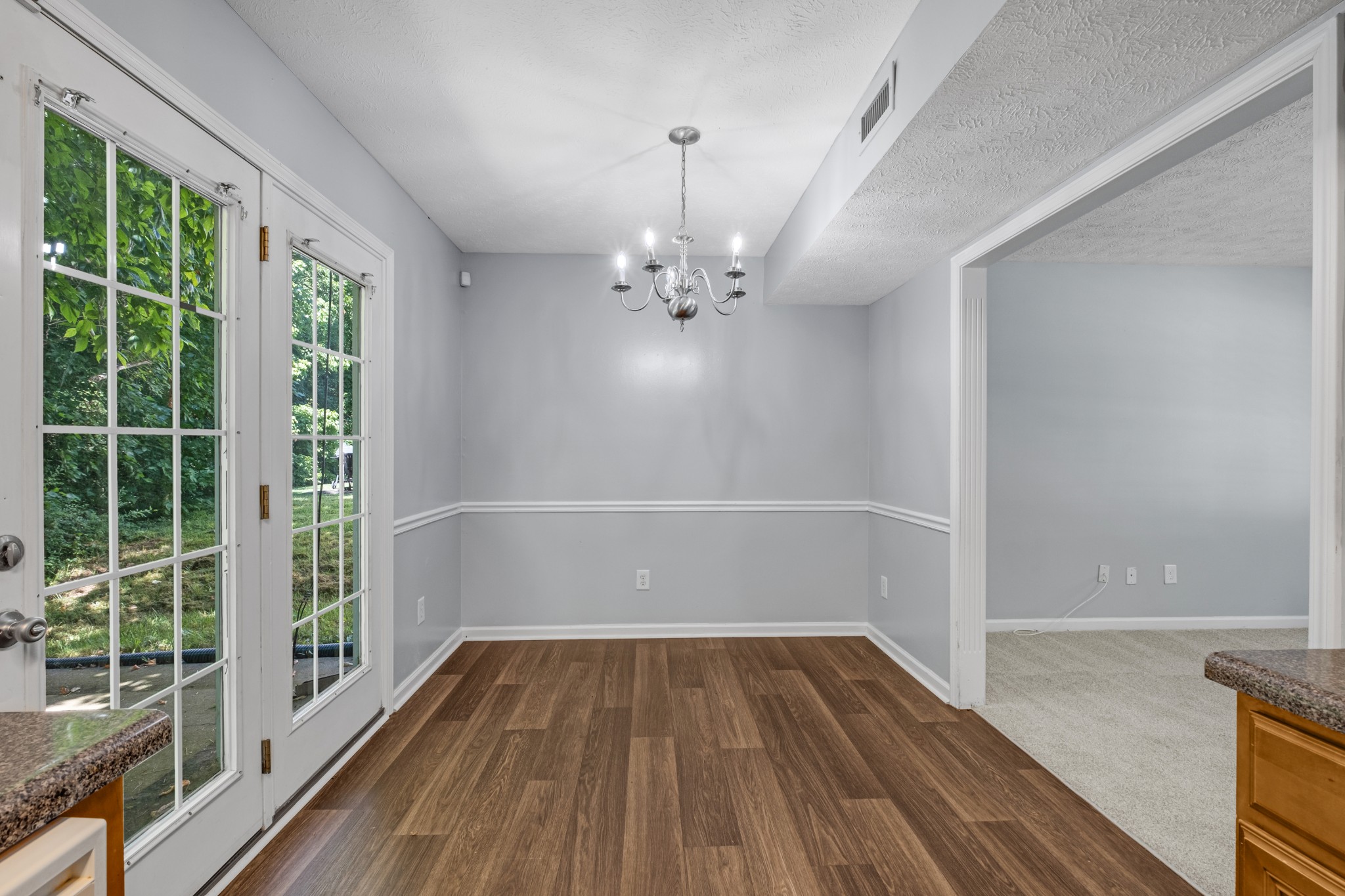 809 Dover Glen Drive Antioch, TN 37013 - Photo 8 of 23 a view of a room with wooden floor and windows