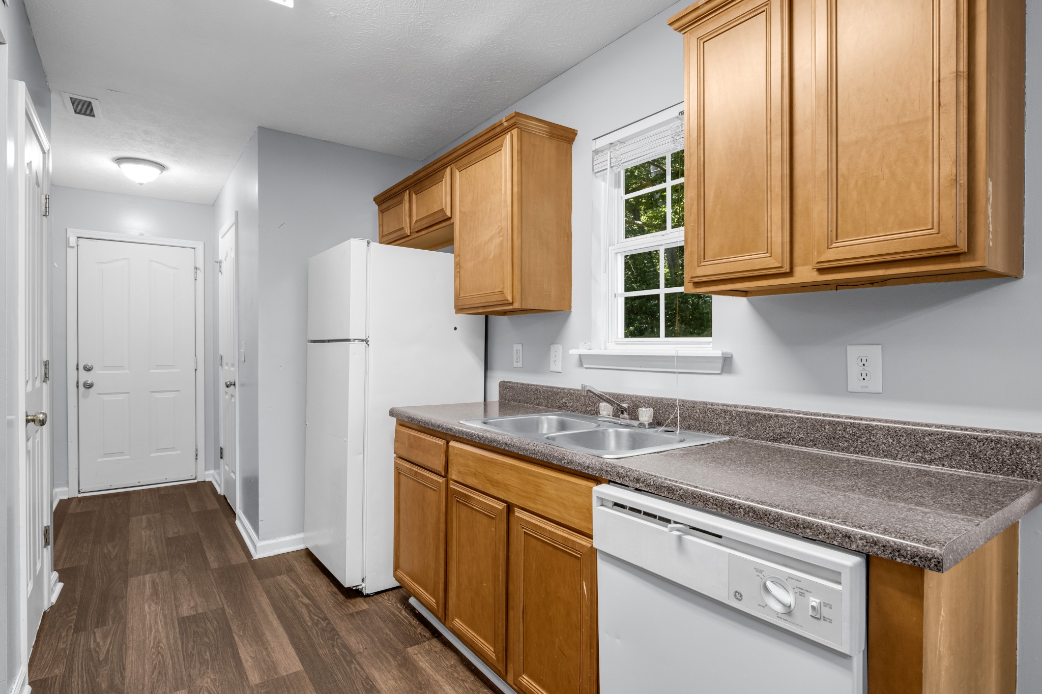 809 Dover Glen Drive Antioch, TN 37013 - Photo 10 of 23 a kitchen with a sink and a refrigerator