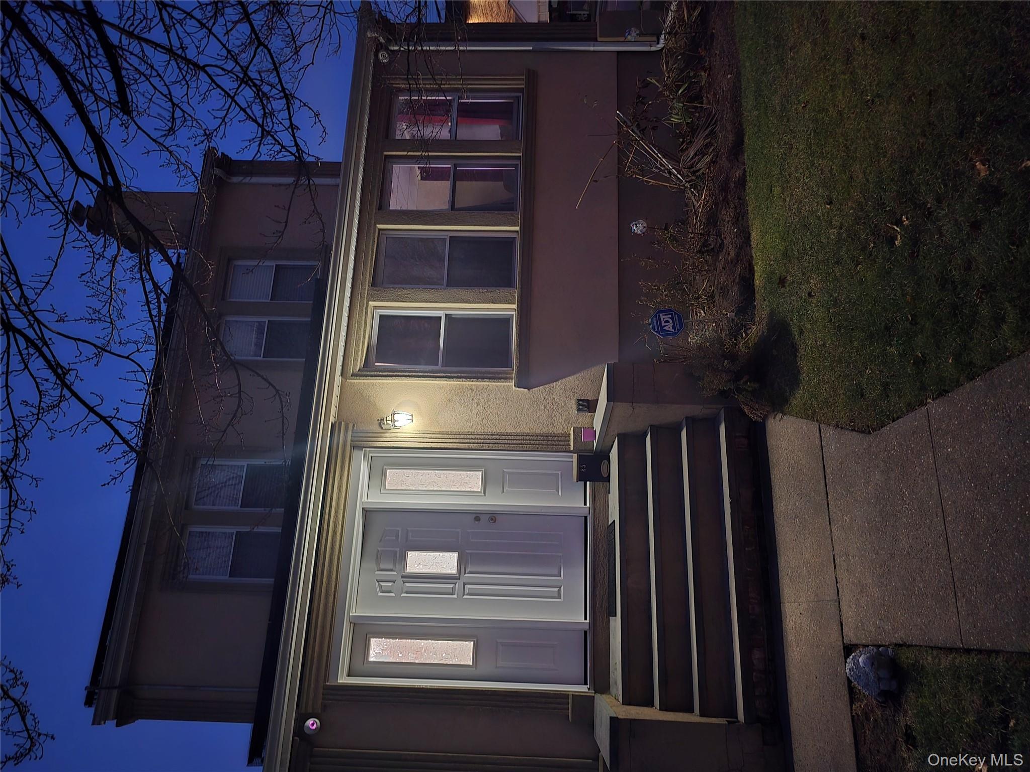 a house view with a garden space