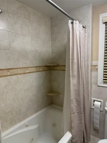 a bathroom with a shower and a toilet