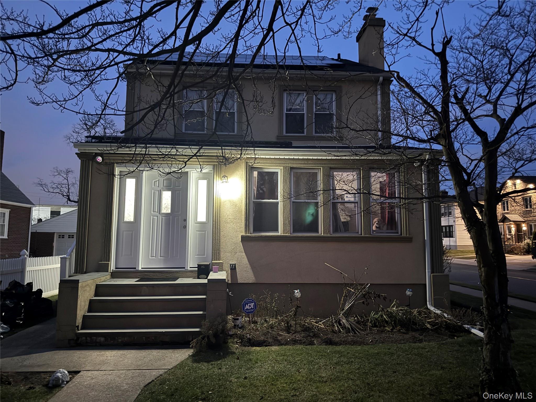 85 Bucknell Road Valley Stream, NY 11580 - Photo 2 of 15 a front view of a house with a garden