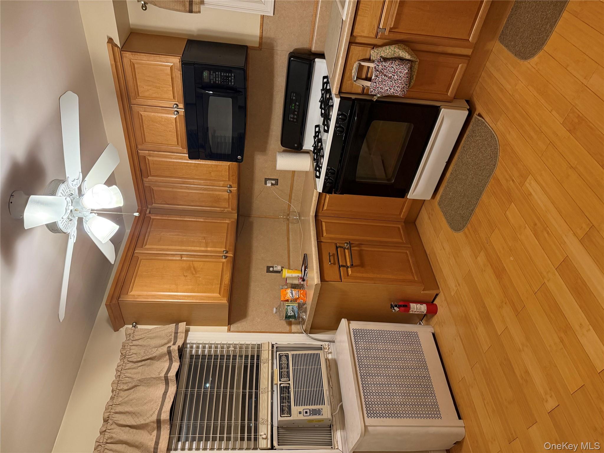 85 Bucknell Road Valley Stream, NY 11580 - Photo 3 of 15 a kitchen with stainless steel appliances a stove a sink and a microwave
