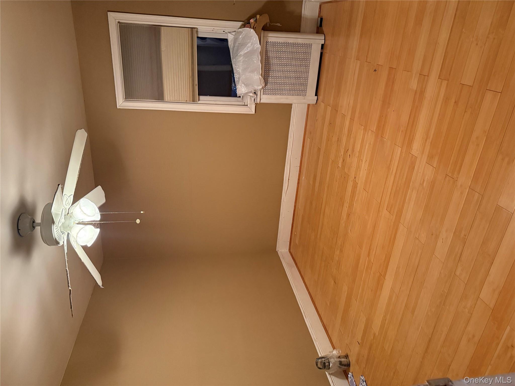 85 Bucknell Road Valley Stream, NY 11580 - Photo 8 of 15 wooden floor in an empty room