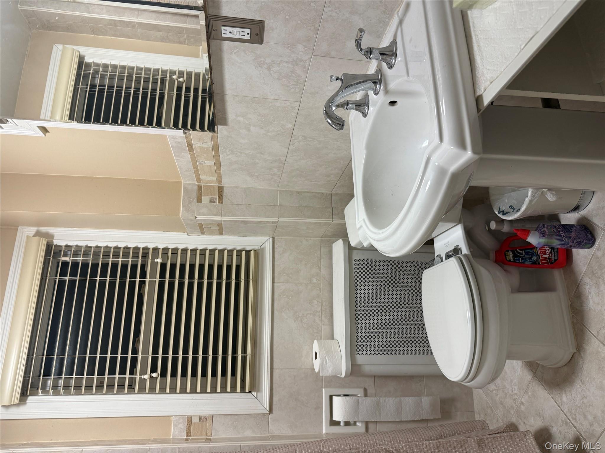 85 Bucknell Road Valley Stream, NY 11580 - Photo 10 of 15 a bathroom with a sink and a toilet