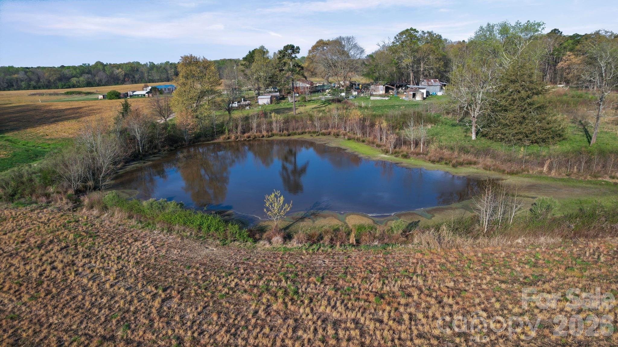 0 Rape Road Monroe, NC 28112 - Photo 13 of 21 a view of a lake with a mountain in the background