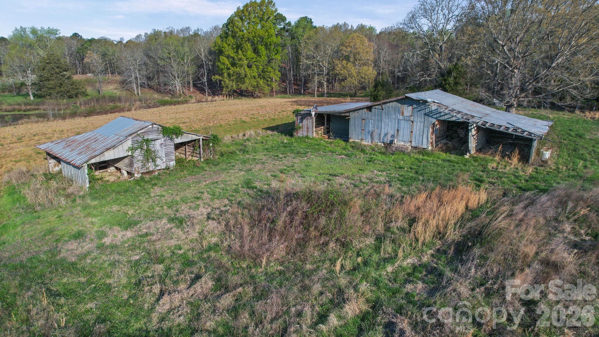 0 Rape Road Monroe, NC 28112 - Photo 20 of 21 a view of a house with a yard and a wooden fence