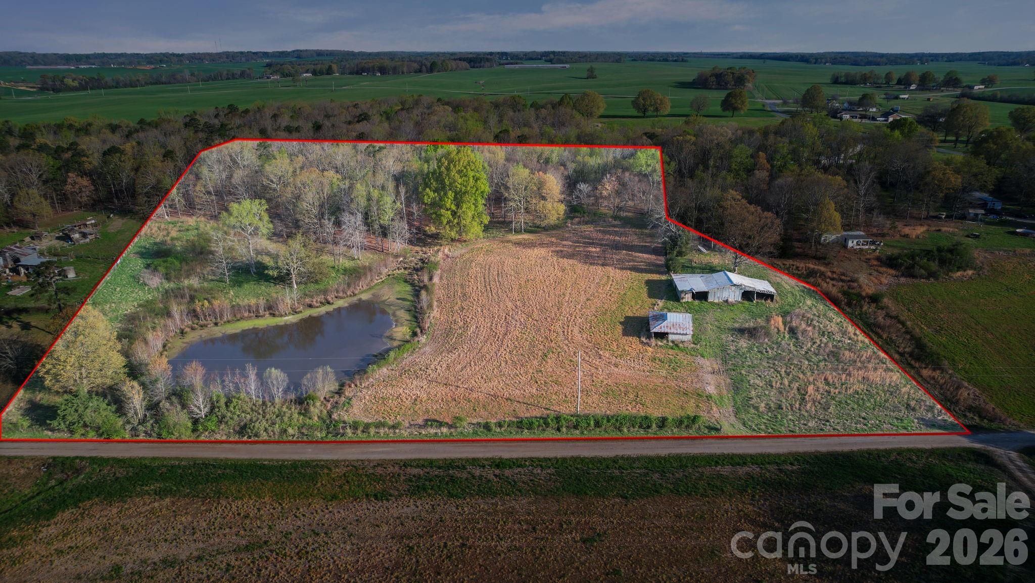 0 Rape Road Monroe, NC 28112 - Photo 2 of 21 an aerial view of a house with a yard