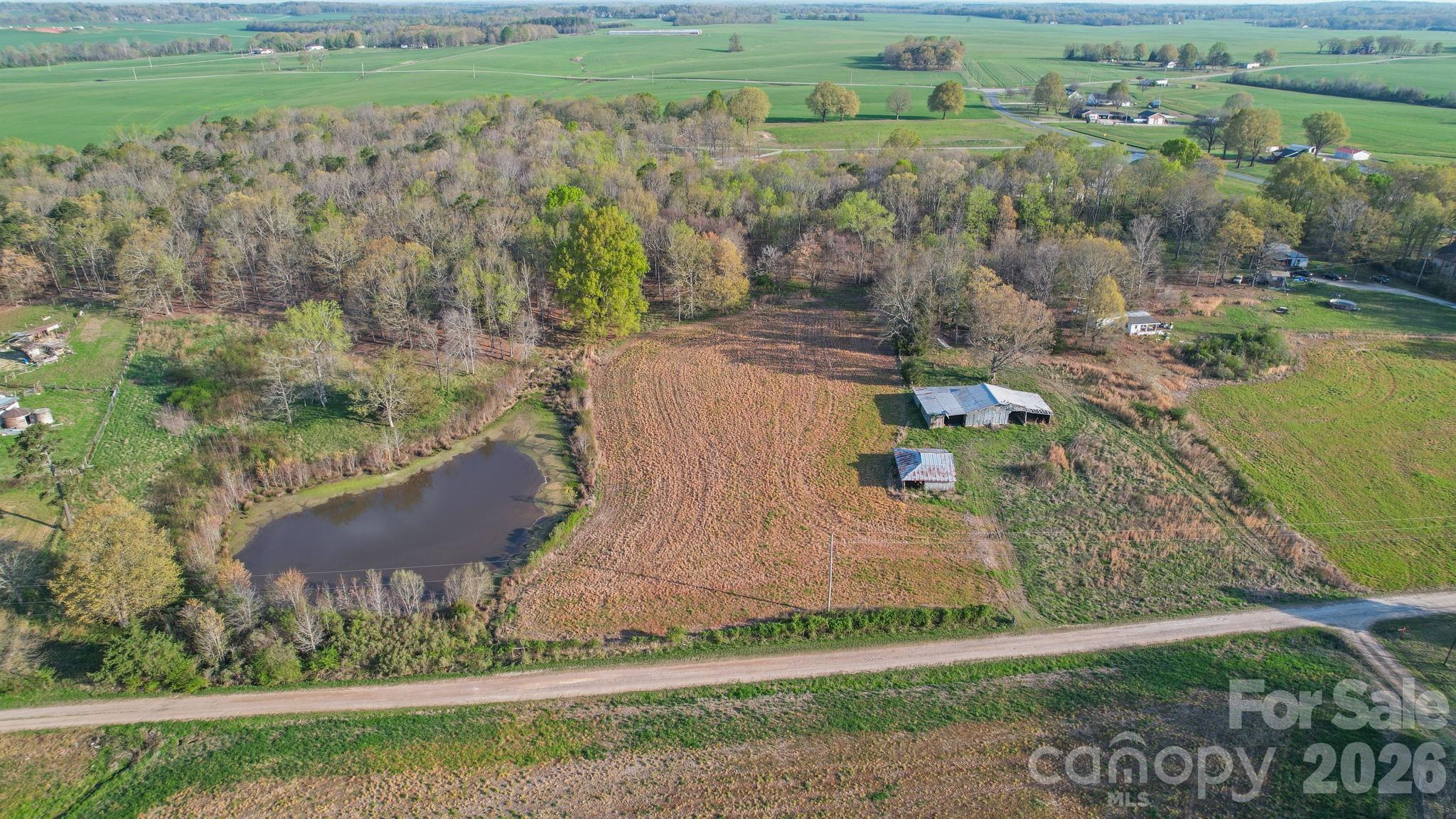 0 Rape Road Monroe, NC 28112 - Photo 3 of 21 aerial view of a house with a yard and lake view
