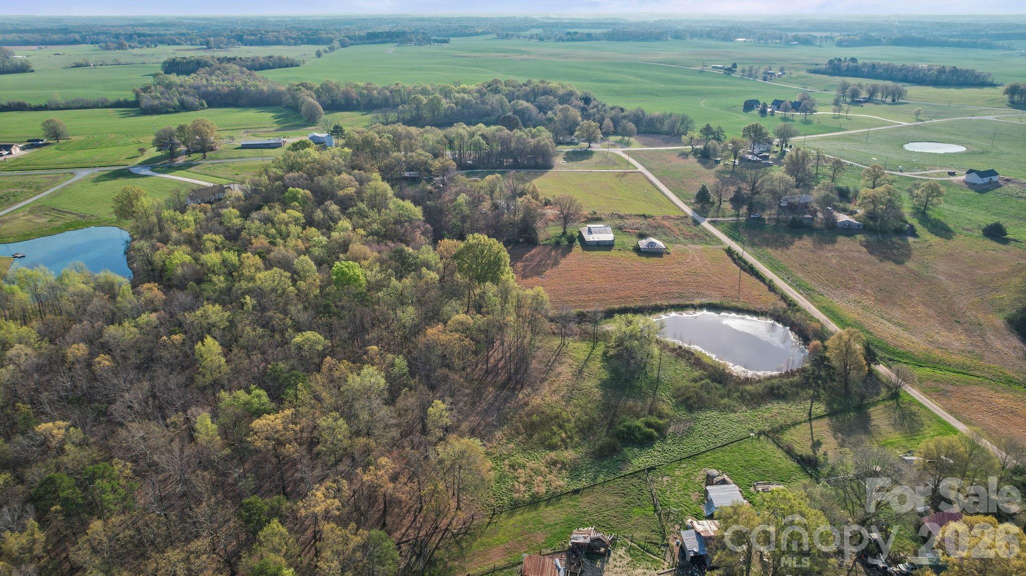 0 Rape Road Monroe, NC 28112 - Photo 8 of 21 an aerial view of a house with a yard