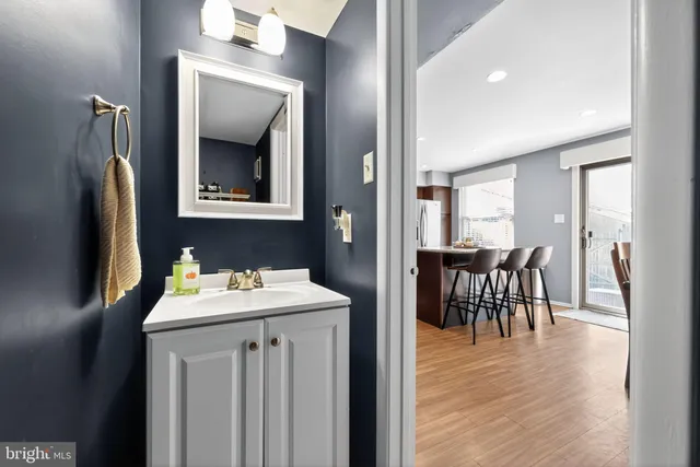 a en suite bathroom with a sink and a mirror