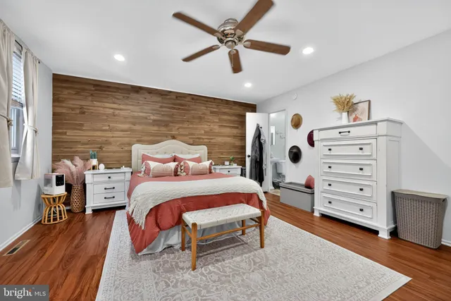 a bedroom with a bed and a dresser