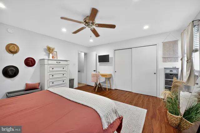 a bedroom with a bed and cabinets