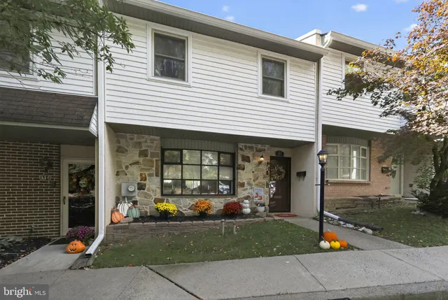 a front view of a house with swimming pool