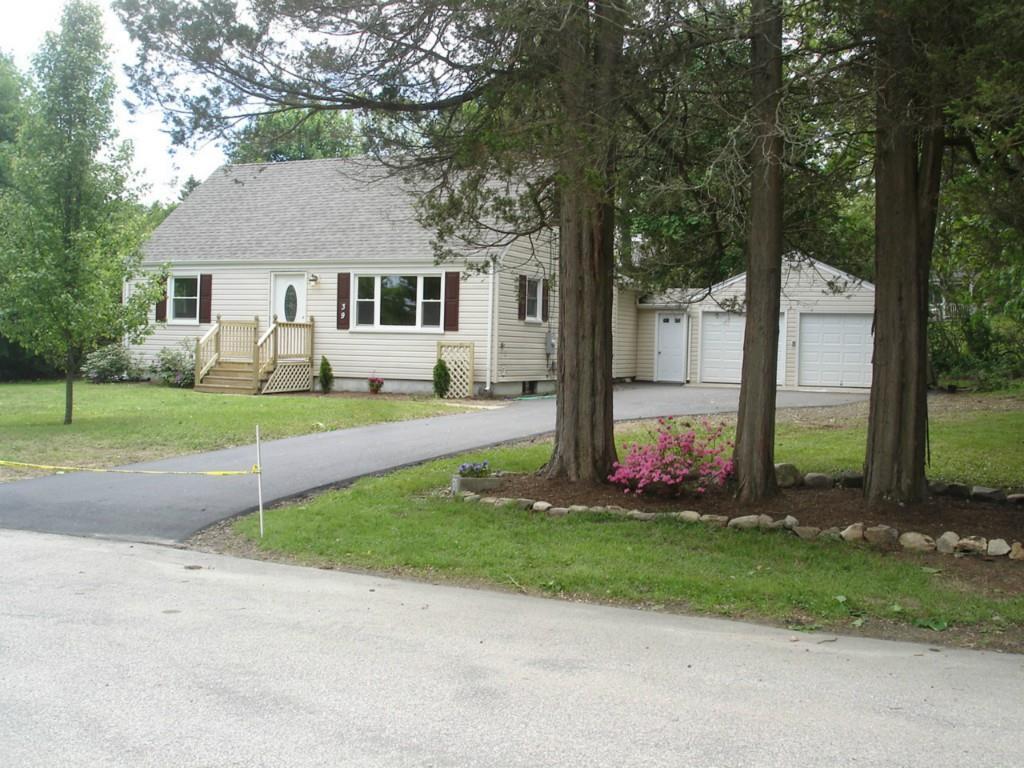 39 Virginia Road Montville, CT 06370 - Photo 1 of 1 a front view of a house with a yard and tree