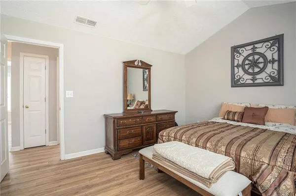 a room with a bed and a mirror