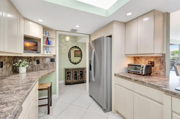 a view of a balcony with chairs