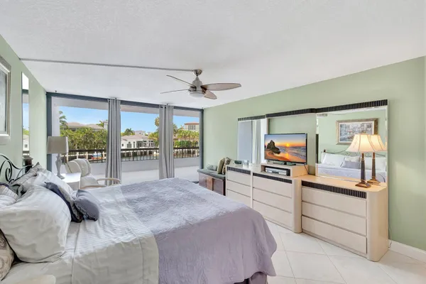 a view of a house with yard and lake view