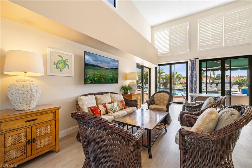 565 Beachwalk Circle, Unit T102 Naples, FL 34108 - Photo 25 of 33 a living room with furniture