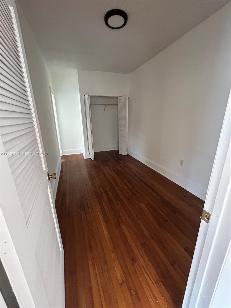 529 Northeast 66th Street, Unit 8 Miami, FL 33138 - Photo 4 of 5 a view of entryway with wooden floor