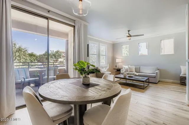 a bedroom with a table and chairs