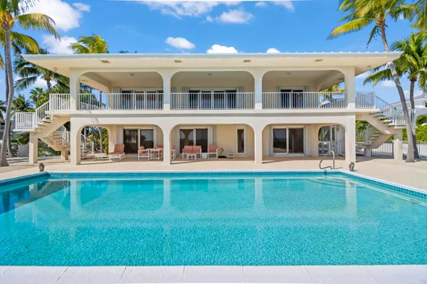 a front view of a house with swimming pool