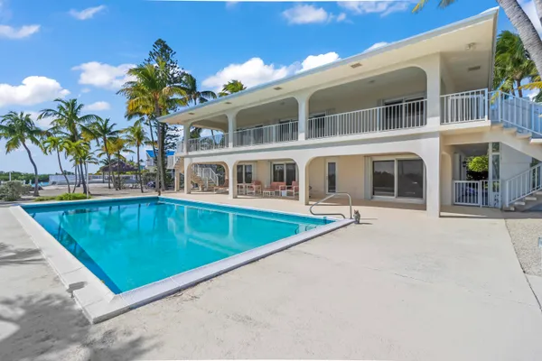 a view of a house with swimming pool
