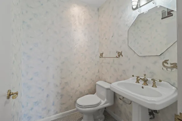 a bathroom with a sink and a toilet