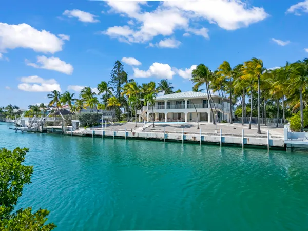 a view of a lake with a house in the background