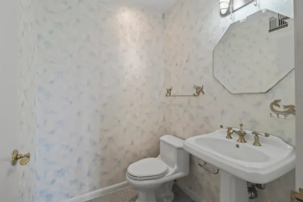 a bathroom with a sink and a toilet