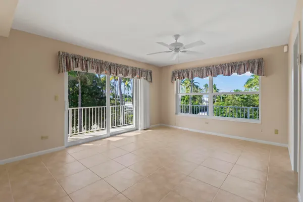 a view of balcony with a palm tree