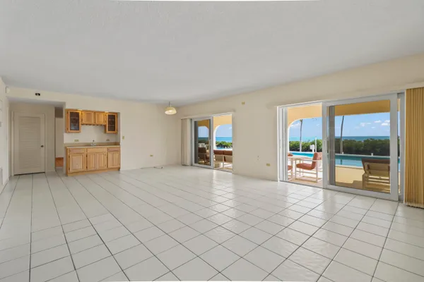 a bathroom with a granite countertop sink and shower