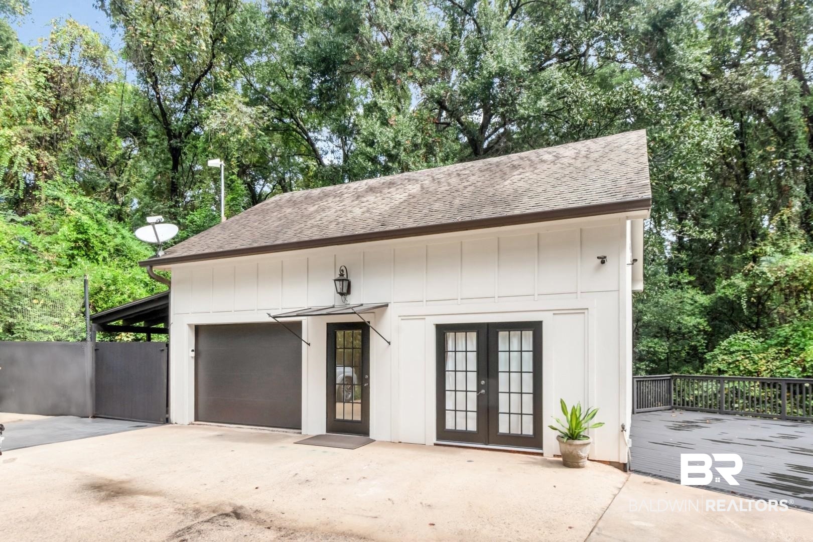 4810 Mums Court Mobile, AL 36608 - Photo 42 of 50 Garage with french doors and view of wooded area