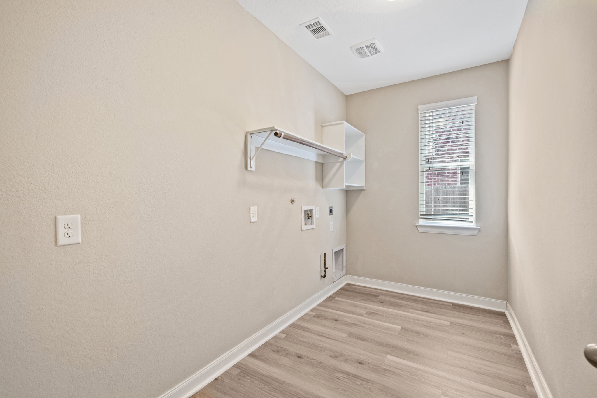22523 Birch Ridge Meadow Drive Spring, TX 77389 - Photo 18 of 39 a view of an empty room with wooden floor and a window
