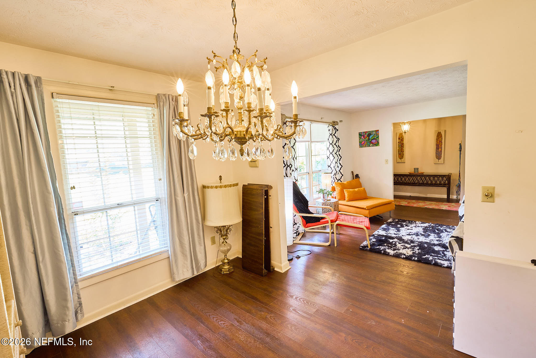 8965 San Rae Road Jacksonville, FL 32257 - Photo 10 of 46 a living room with fireplace furniture and a chandelier