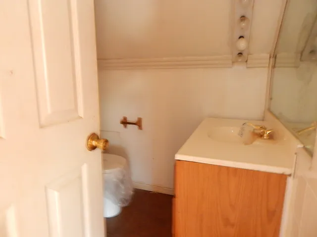 a bathroom with a sink and vanity