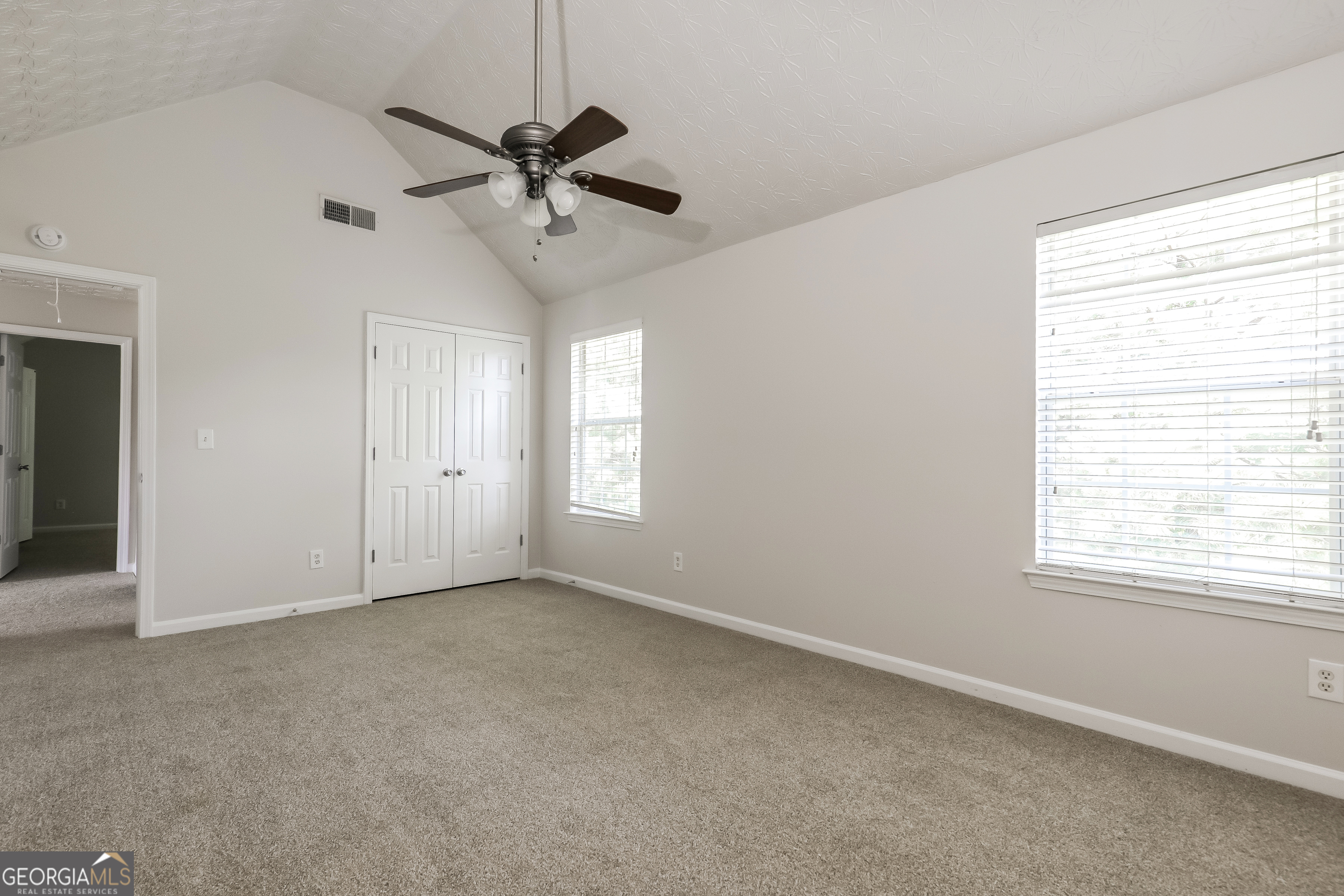 7812 Bell Tower Lane Fairburn, GA 30213 - Photo 13 of 17 a view of an empty room with a window