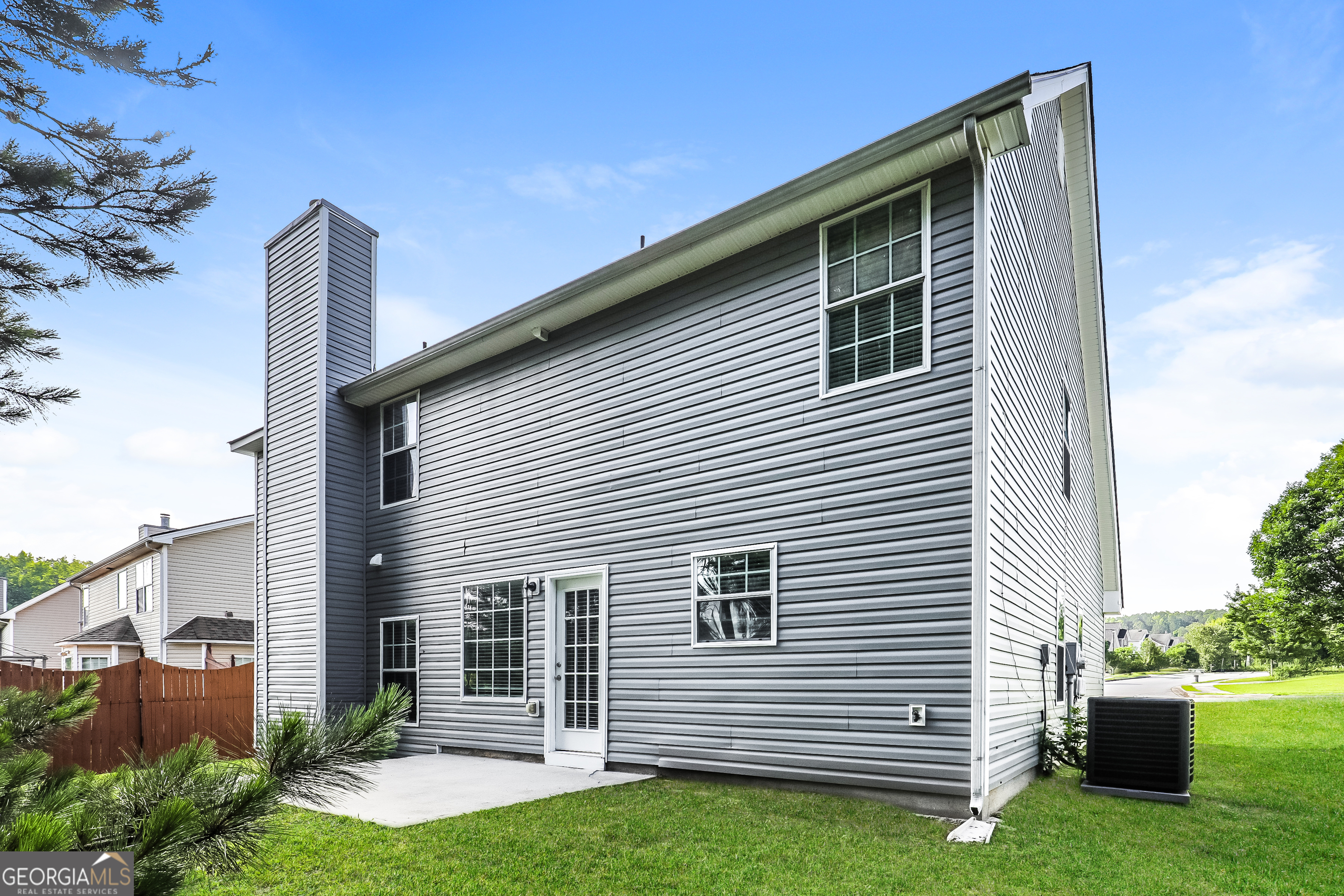 7812 Bell Tower Lane Fairburn, GA 30213 - Photo 15 of 17 a front view of a house with a yard