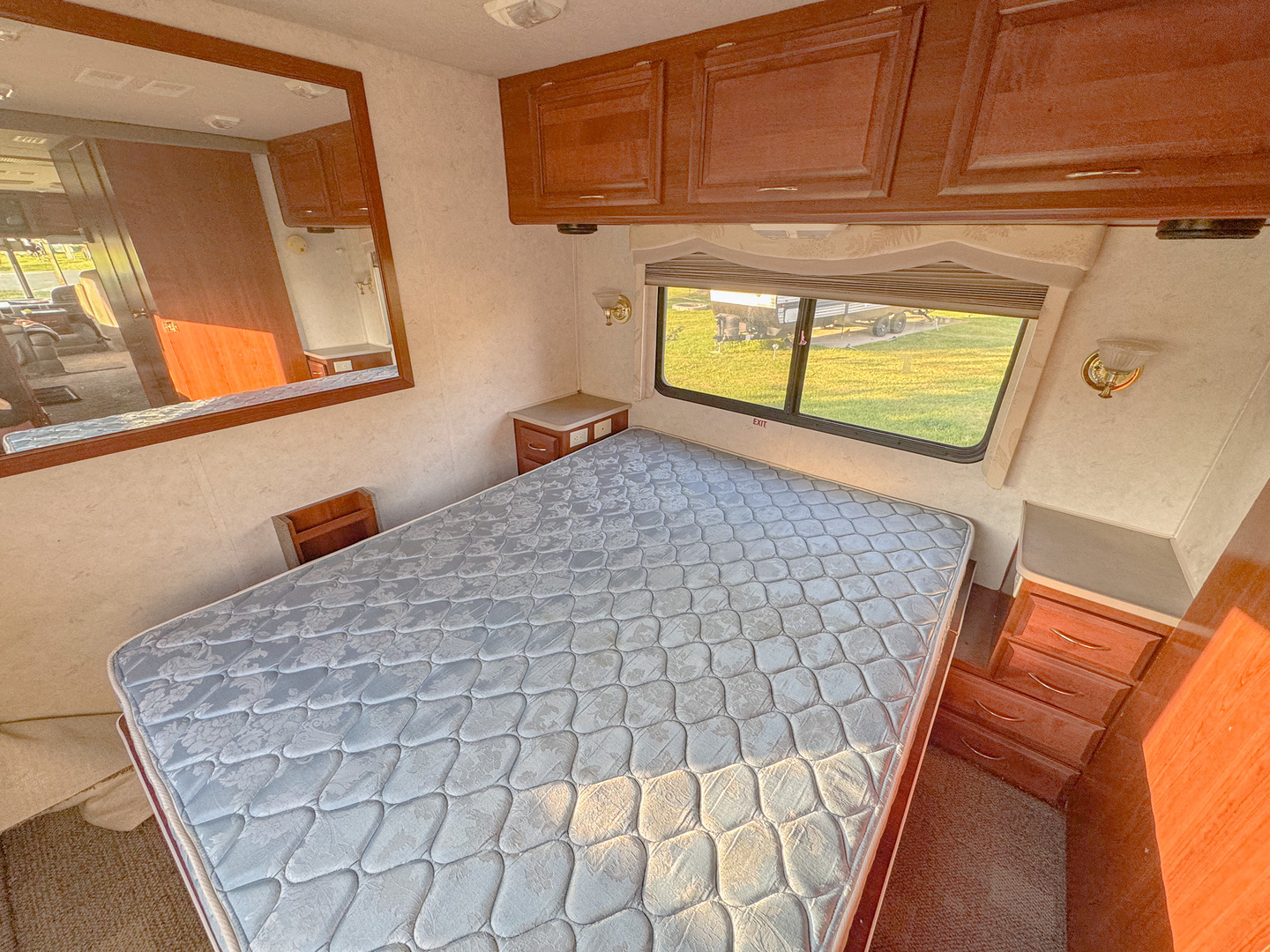 22-70 Woodhaven Sublette, IL 61367 - Photo 12 of 13 a bedroom with a bed and mirror