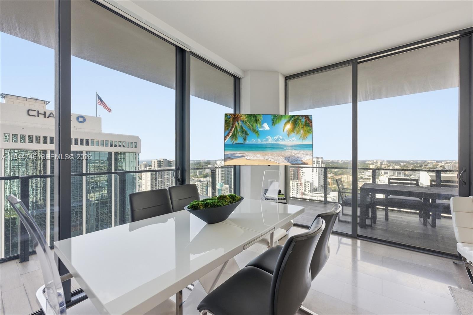88 Southwest 7th Street, Unit 2302 Miami, FL 33130 - Photo 9 of 43 a view of a dining room with furniture window and outside view