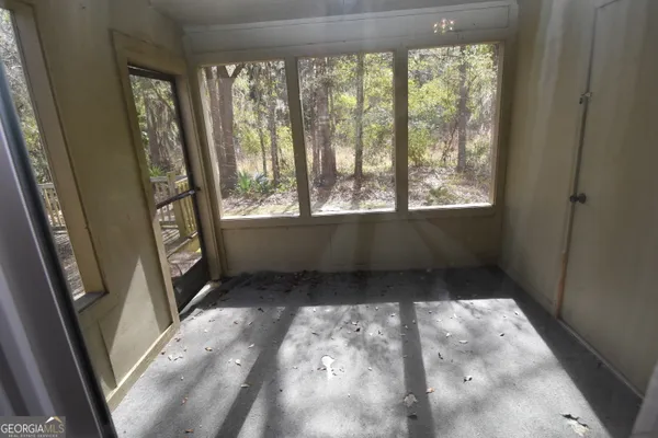a view of an empty room and window