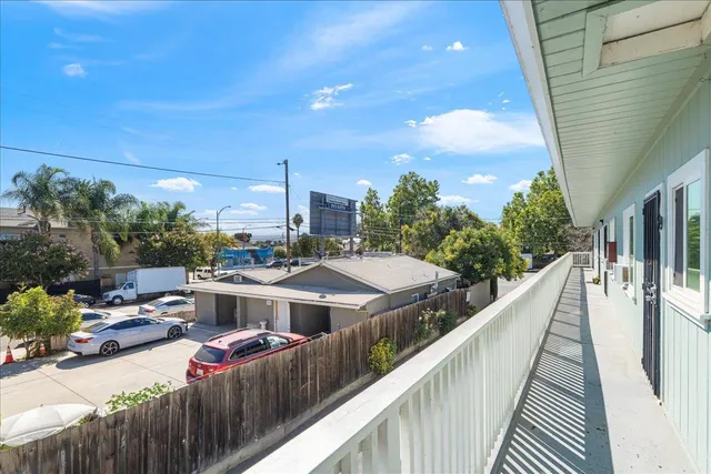 a view of a balcony with chairs