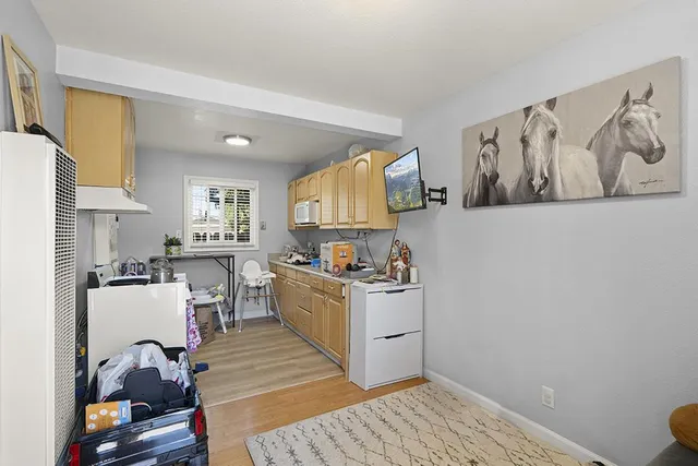 a kitchen with a stove and a refrigerator
