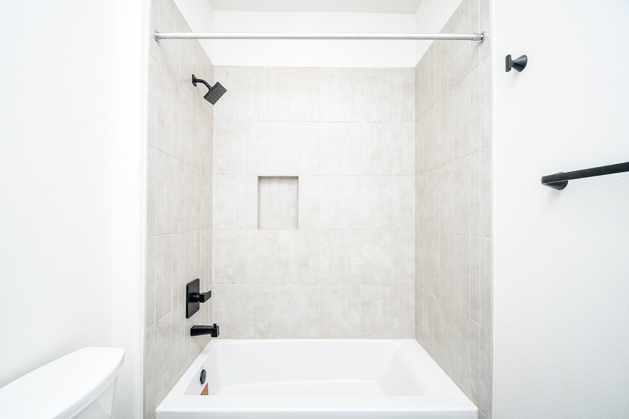 4101 Victoria, Unit B Dickinson, TX 77539 - Photo 19 of 33 a bathroom with a bathtub and a shower