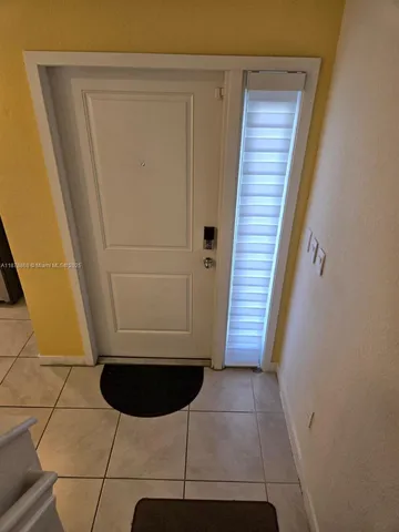 a kitchen with a refrigerator and cabinets
