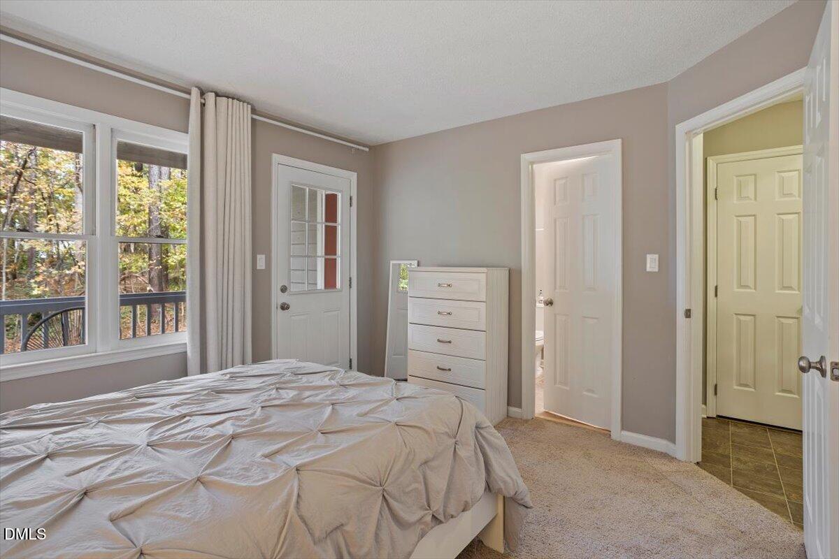 100 Hunting Chase, Unit 1D Cary, NC 27513 - Photo 16 of 33 a bedroom with a bed and a window
