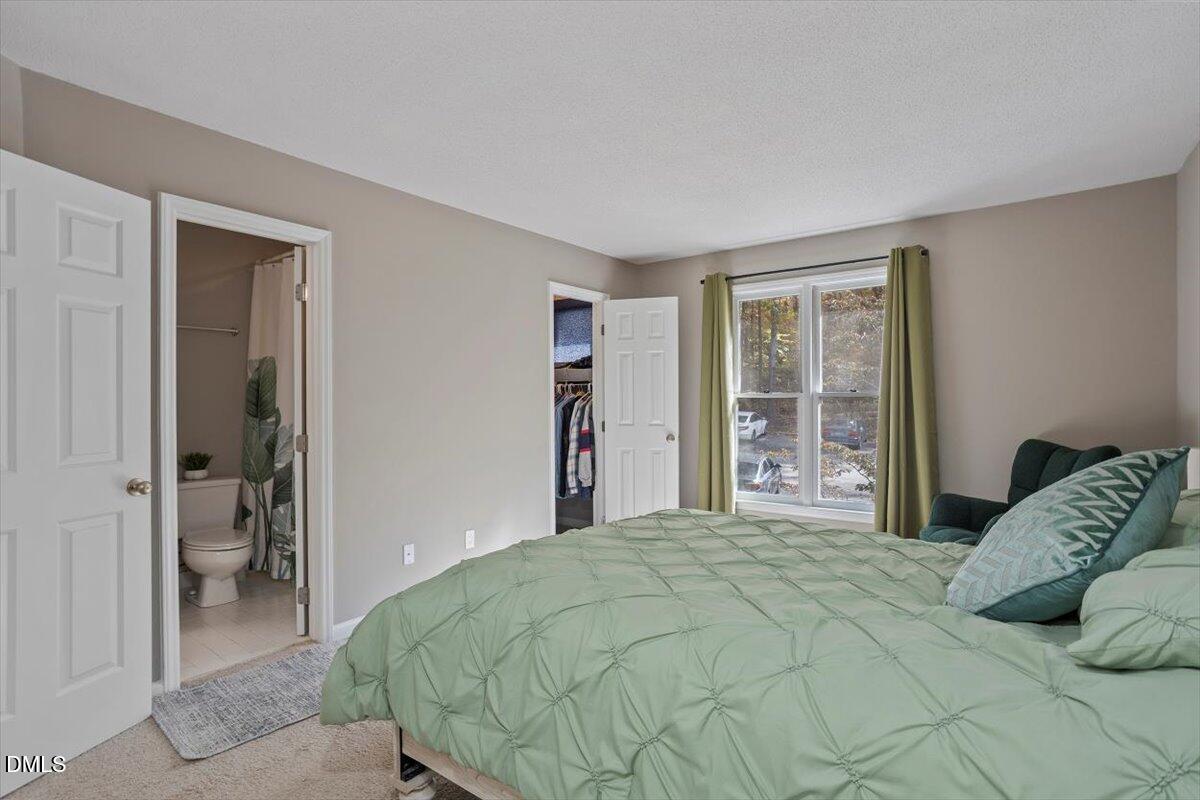 100 Hunting Chase, Unit 1D Cary, NC 27513 - Photo 24 of 33 a bedroom with a bed and a window