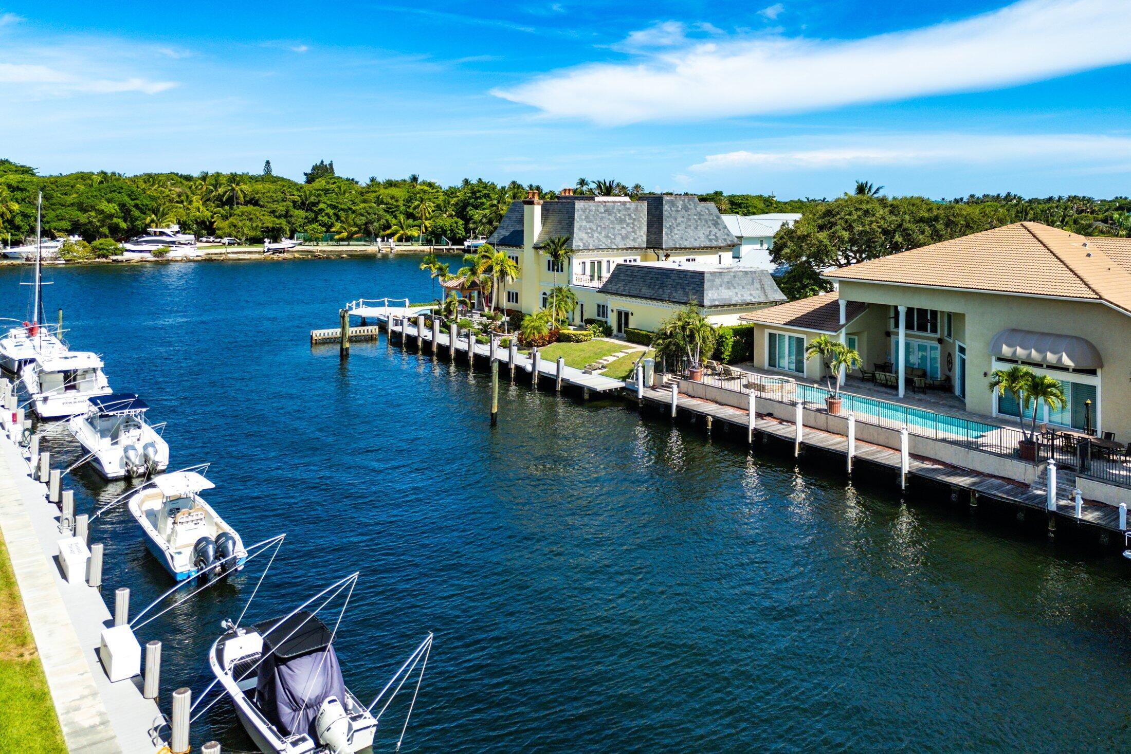 3050 Northeast 48th Court, Unit 402 Lighthouse Point, FL 33064 - Photo 8 of 49 an aerial view of residential houses with outdoor space and lake view
