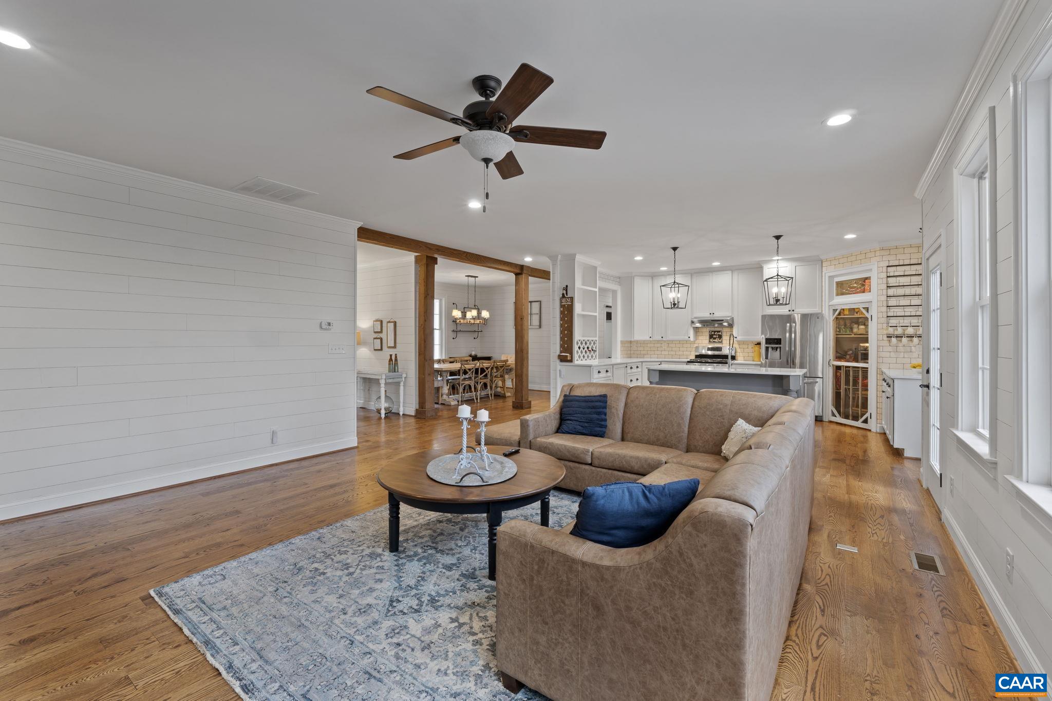 269 Devon Drive Ruckersville, VA 22968 - Photo 11 of 51 a living room with furniture and a wooden floor